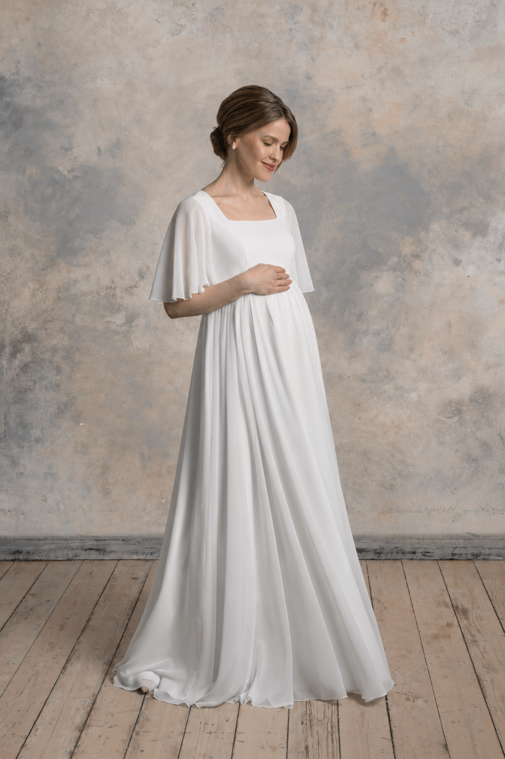 Maternity chiffon gown with a square neckline and flutter sleeves, front-side view.