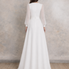 Wedding dress with square neckline, sheer long sleeves and flowing A-line skirt in minimalist style