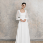 Wedding dress with square neckline, sheer long sleeves and softly flowing skirt with delicate waist shaping