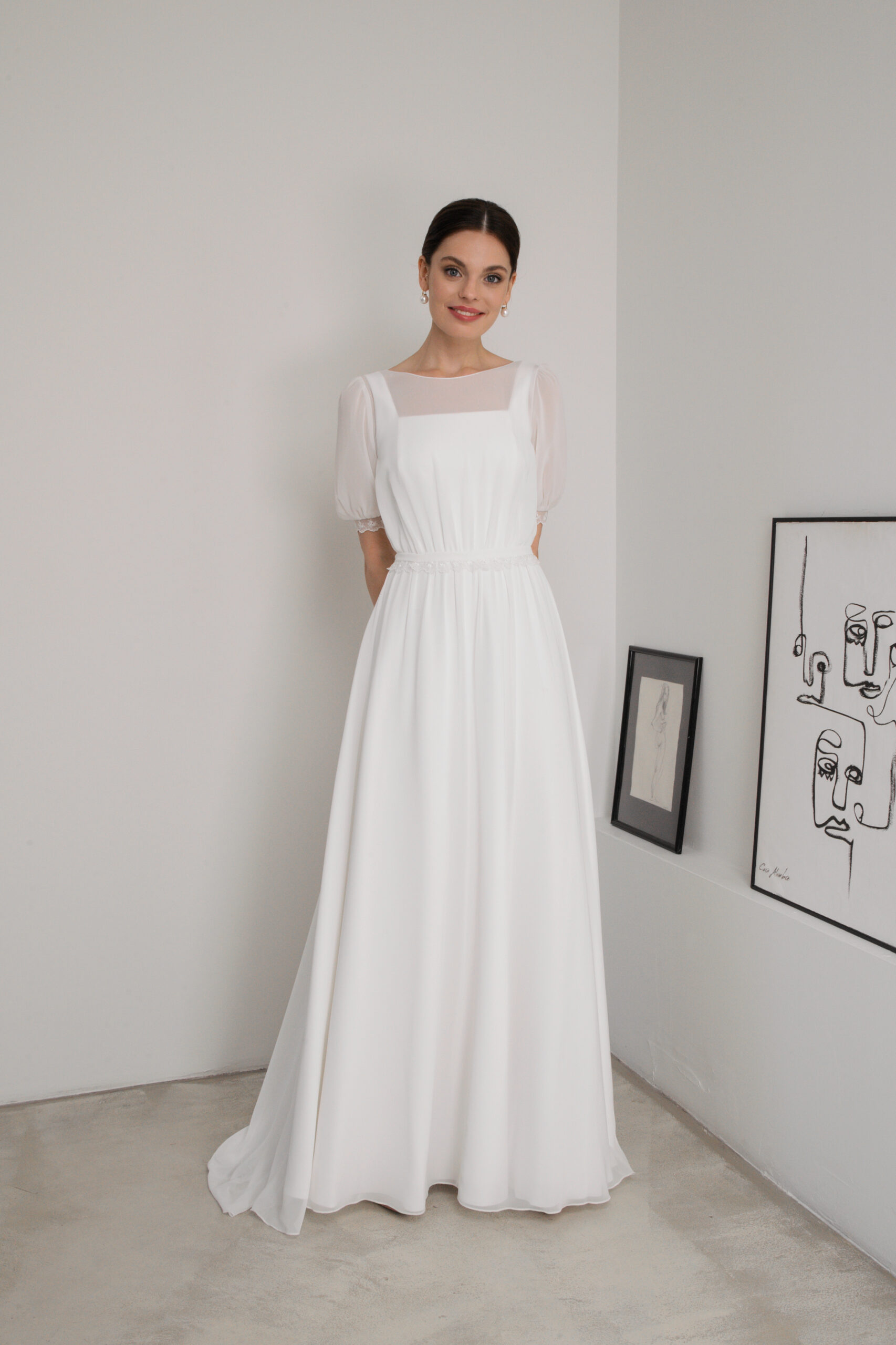 front view of chiffon gown with square neckline and defined waist