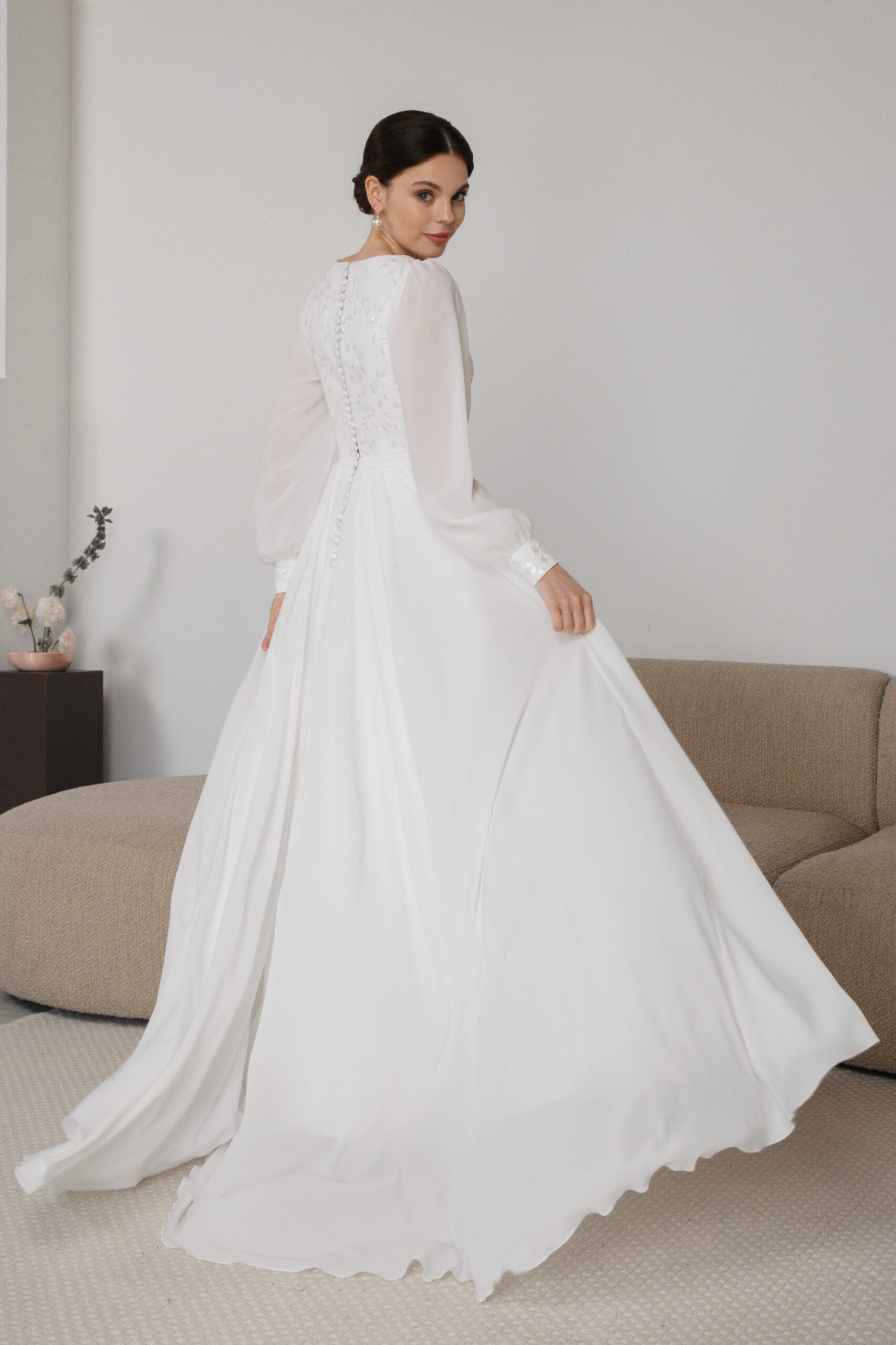 Flowing chiffon wedding dress with embroidered bodice and long train