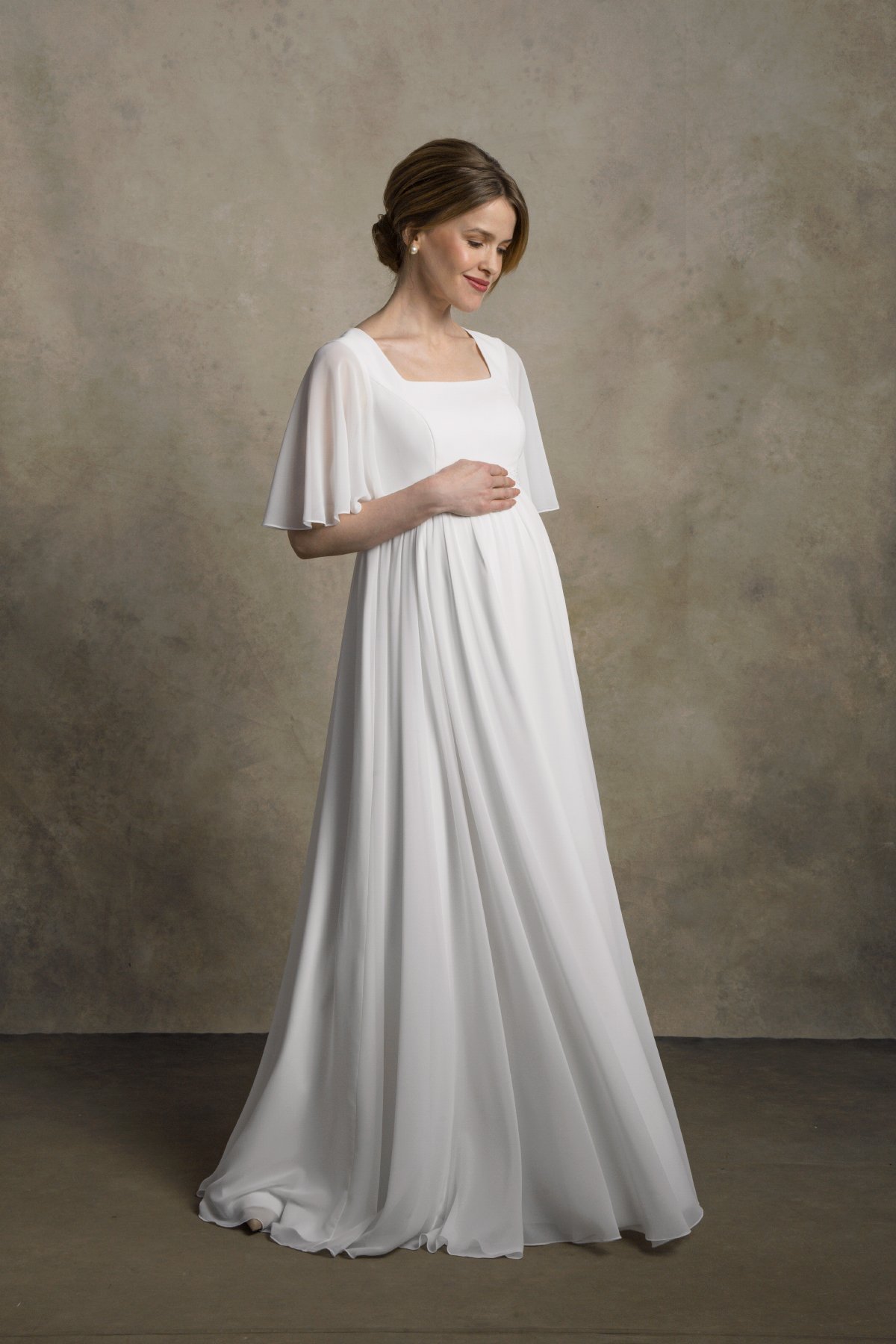 Maternity chiffon gown with a square neckline and flutter sleeves, front-side view.