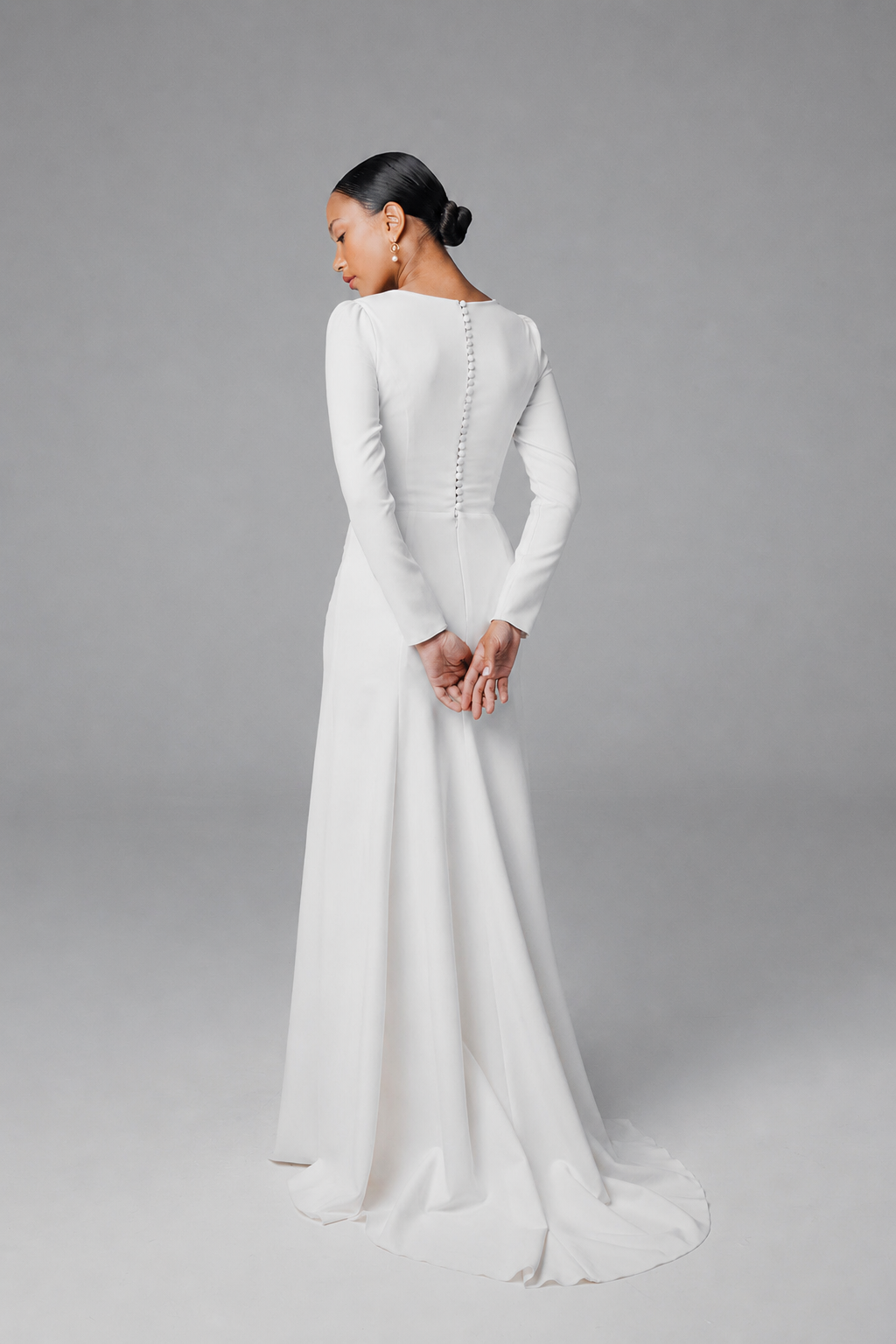 Minimalist long sleeve wedding dress Clara with covered buttons on the back
