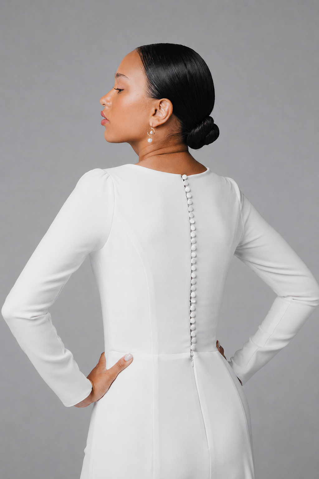 Long sleeve crepe wedding dress with clean back detail